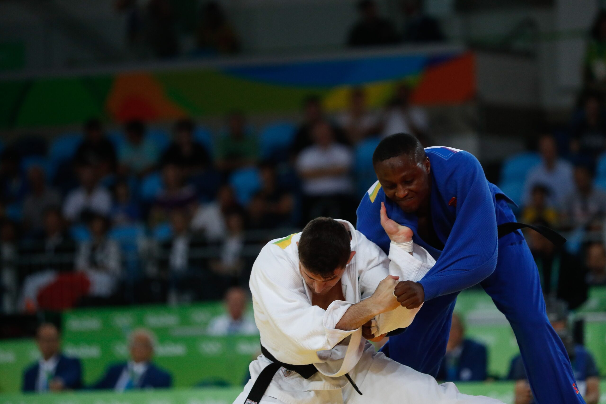 Japanese martial arts: two judoka in blue and white uniforms competing at Rio 2016