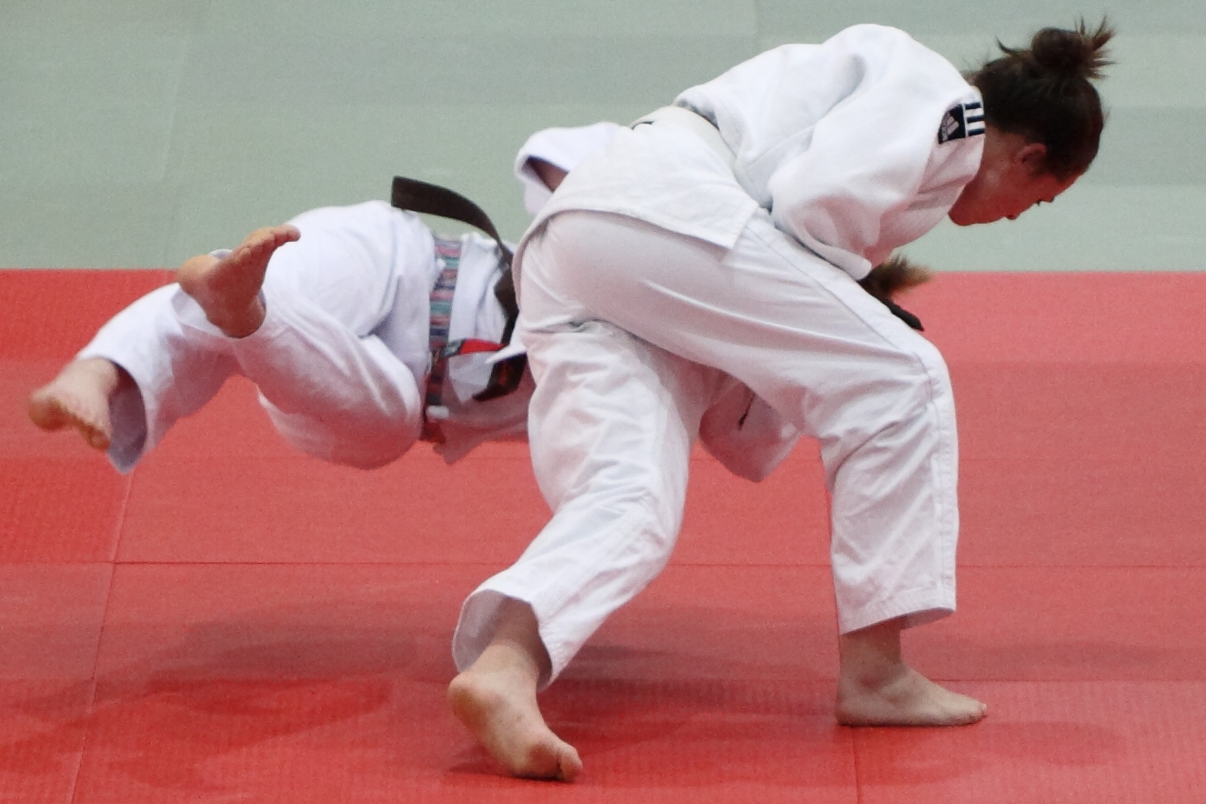 Japanese martial arts: two judoka performing a throw during a judo match